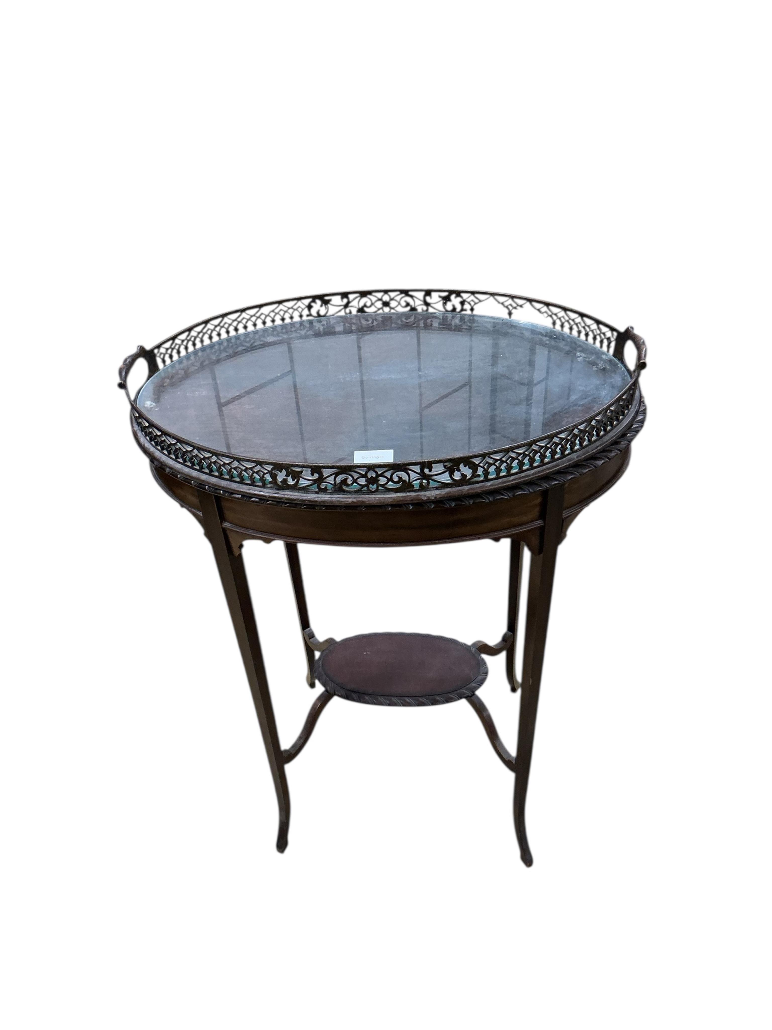 An Edwardian oval galleried tea tray on associated stand, width 59cm, depth 39cm, height 78cm